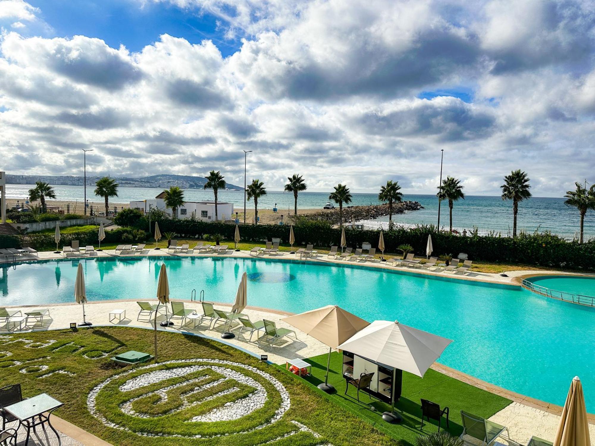 Grand Mogador Sea View & Spa Tangeri Esterno foto View of the pool at the Hotel